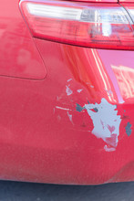 Rear Bumper Red Car. Consequences After The Accident. Place Of Impact After The Accident. Old Paint On The Car. Plastic Bumper On The Car