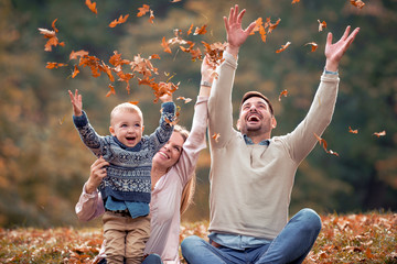 Wall Mural - Happy family in autumn park