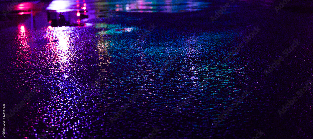 Background of wet asphalt with neon light. Blurred background, night lights of a big city, reflection, puddles. Dark neon bokeh. - obrazy, fototapety, plakaty 