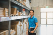 © Sirichai - Portrait Of Manager In Warehouse. wholesale, logistic, people and export concept . Business owner Using Tablet Computer In Distribution Warehouse.