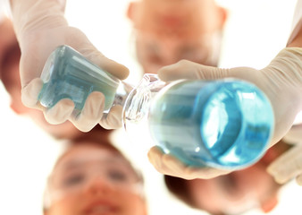 Wall Mural - image is blurred. beakers in hand, and scientists