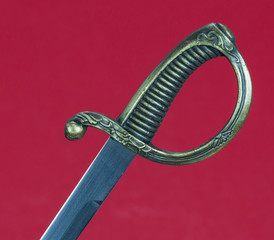 saber handle on red background