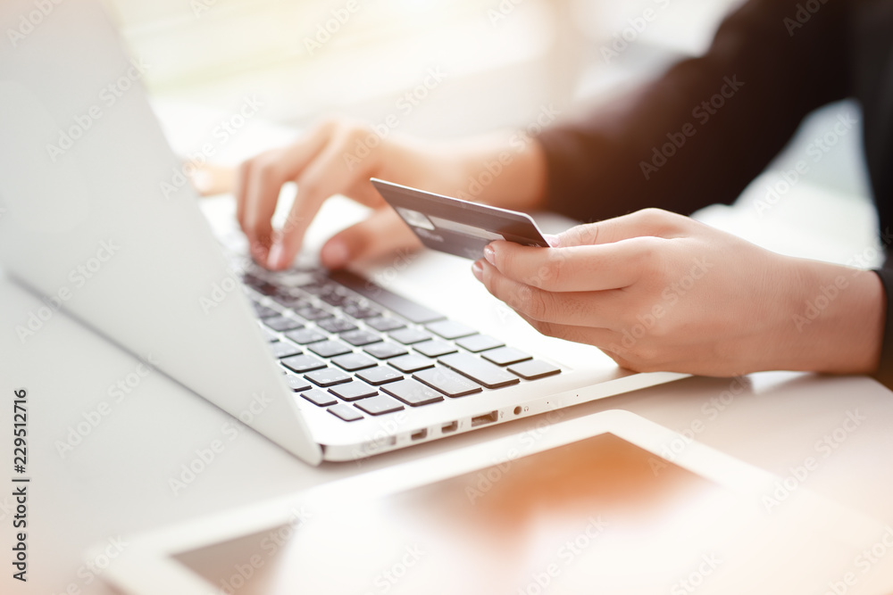 shopping and online payment by using laptop computer and tablet with credit card