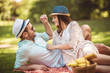 © Mediteraneo - Beautiful couple enjoying picnic time outdoor
