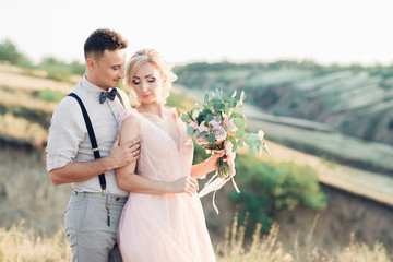 wedding couple on the nature in summer day.