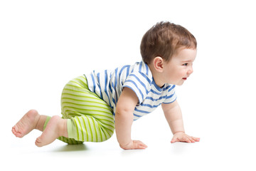 side view of baby boy crawling isolated on white background