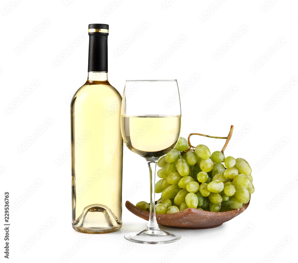 Composition with tasty wine and fresh grapes on white background