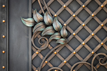 wrought-iron gates, ornamental forging, forged elements close-up