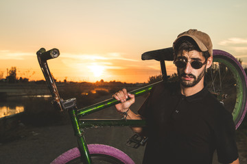 Wall Mural - Portrait of a young man with a bmx bicycle