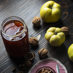 Wall Mural - Sweet quince jam in glass dish with  quinces