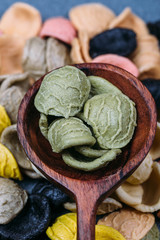 Traditional Italian Rainbow pasta. Colored raw pasta on a stone background