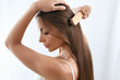 © puhhha - Beauty Hair Care. Beautiful Woman Brushing Long Healthy Hair