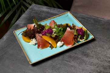 Wall Mural - Ham and Peach Salad with Dor Blue on a Blue Plate