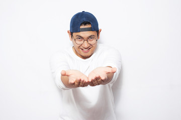 Wall Mural - Happy Young Man Showing Something on His Empty Hands