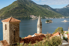 View Of Bay Of Kotor With Two Small Islands (Island Of Saint George And Island Of Our Lady Of The Rocks) And Bell Tower Of Church Of St. Nicholas In Perast Town