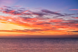 Fototapeta Zachód słońca - Dramatic Sunrise over the Sea