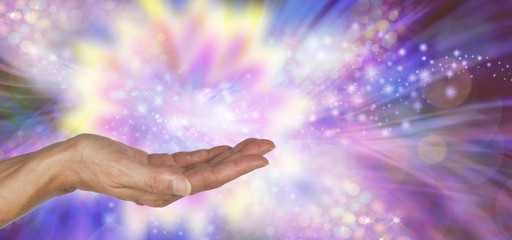 beautiful playful magical energy - female open palm hand surrounded by a colourful sparkling flowing