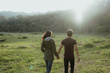 © Odua Images - man and woman walking together in nature