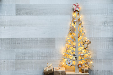 Wall Mural - christmas wooden tree natural decoration ornament and copyspace on old wood board