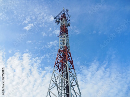 Fotografie, Tablou Cellular Signal Tower or Large antenna with broadcast equipment And the frequency bands in the concept of wireless communications technology from the radio