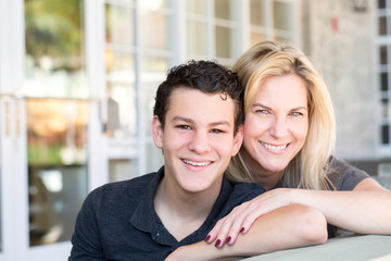 Portrait of a Latin mother and teenage son.