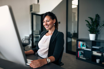 Canvas Print - Portrait of charming administrative manager in the office.