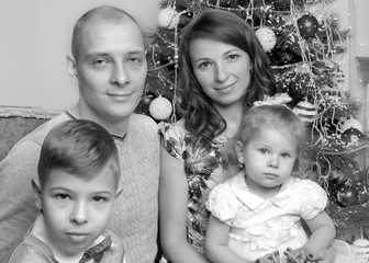 Big happy family with children near the Christmas tree.