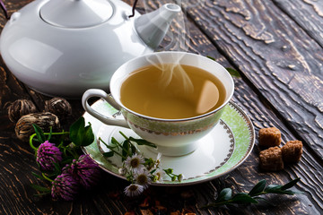 Tea in a cup on an old background