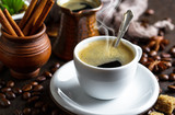 Fototapeta Sawanna - Black coffee in a cup on old background
