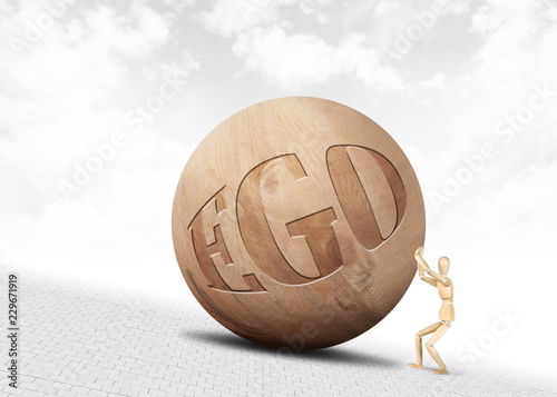 Man pushes a huge wooden ball with inscription Ego upwards along the slope Tableau sur Toile