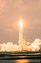 Wall Mural - launch of the spaceship from the spaceport in the morning flight of space shuttle in clouds of smoke