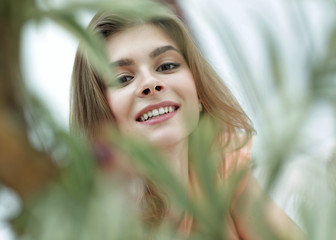 Wall Mural - portrait of smiling woman face on blurred background.