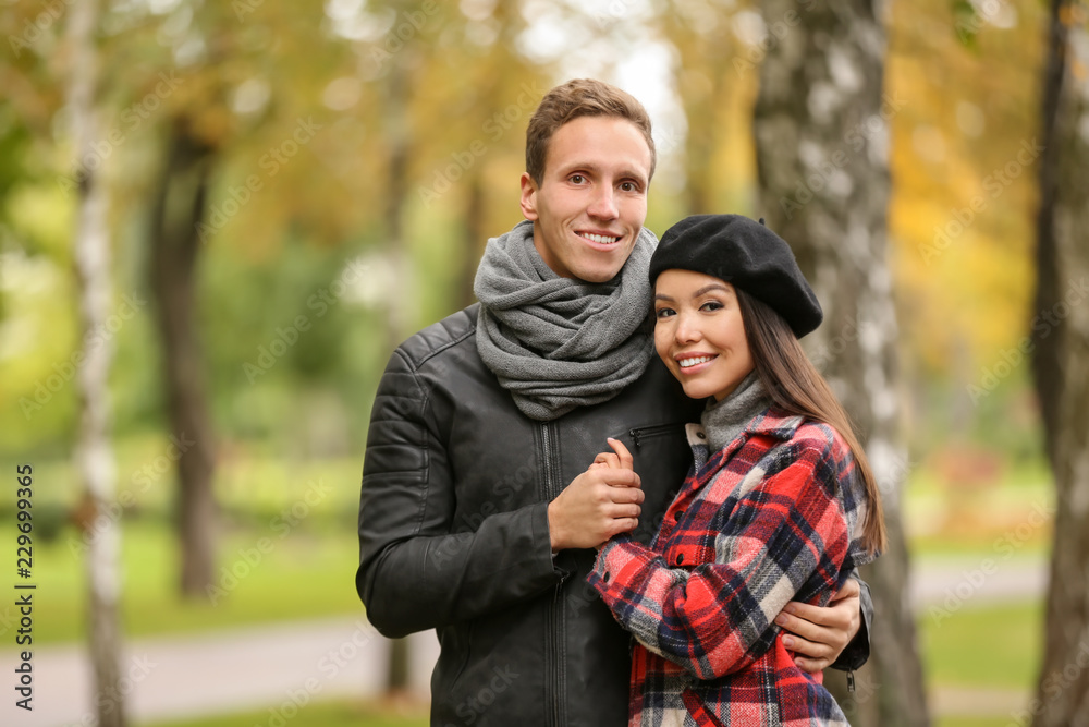 Loving young couple on romantic date in autumn park