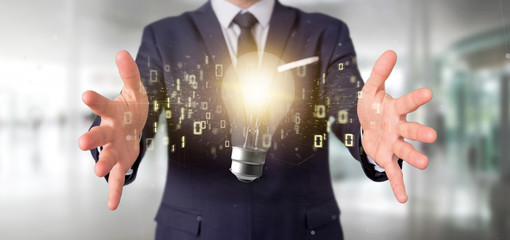 Poster - Businessman holding a bulb lamp idea concept with data all around 3d rendering