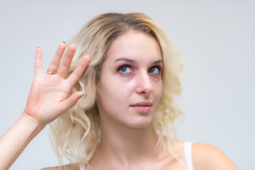 Wall Mural - Portrait of a beautiful blonde girl while working as a professional beautician make-up artist.