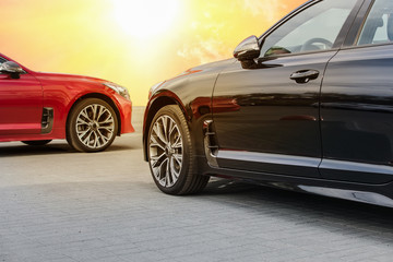 Wall Mural - red and black car under a bright sunny sky