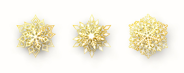 Wall Mural - vector set of 3 white and gold christmas paper cut 3d snowflakes with shadow isolated on white backg