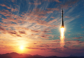 Wall Mural - carrier rocket takes off on background of sunrise