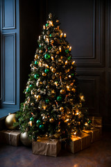 dark room interior with new year tree decorated and present boxes