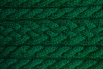 Wall Mural - Texture of warm green knitted winter clothes.