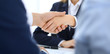 © rogerphoto - Group of business people or lawyers shaking hands finishing up a meeting , close-up. Success at negotiation and handshake concepts