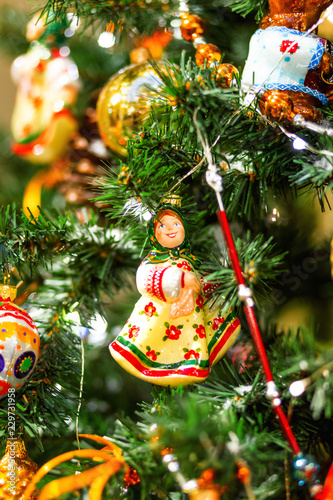 Fir Tree Decorated With Shiny Old Fashioned Toys And Light Bulbs