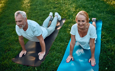 Wall Mural - Senior couple doing sport outdoors