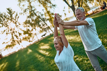 Wall Mural - Senior couple doing sport outdoors