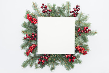 Wall Mural - top view of pine tree wreath with christmas decorations and square blank space in middle isolated on