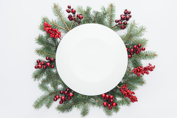 top view of pine tree wreath with christmas decorations and round blank space in middle isolated on 