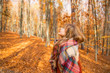 © marrakeshh - Young girl in autumn season in the park, shot of a girl with scarf in fall outdoor