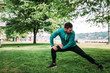 © bnenin - Fit man doing stretching exercises outdoors