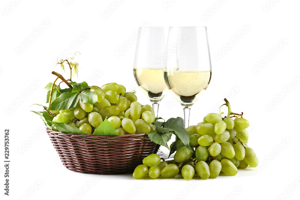 Composition with tasty wine and fresh grapes on white background