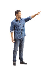 Canvas Print - Young man pointing away